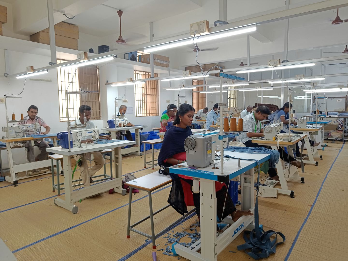 Operators at Juki sewing machines on the Cosmo Textile stitching floor